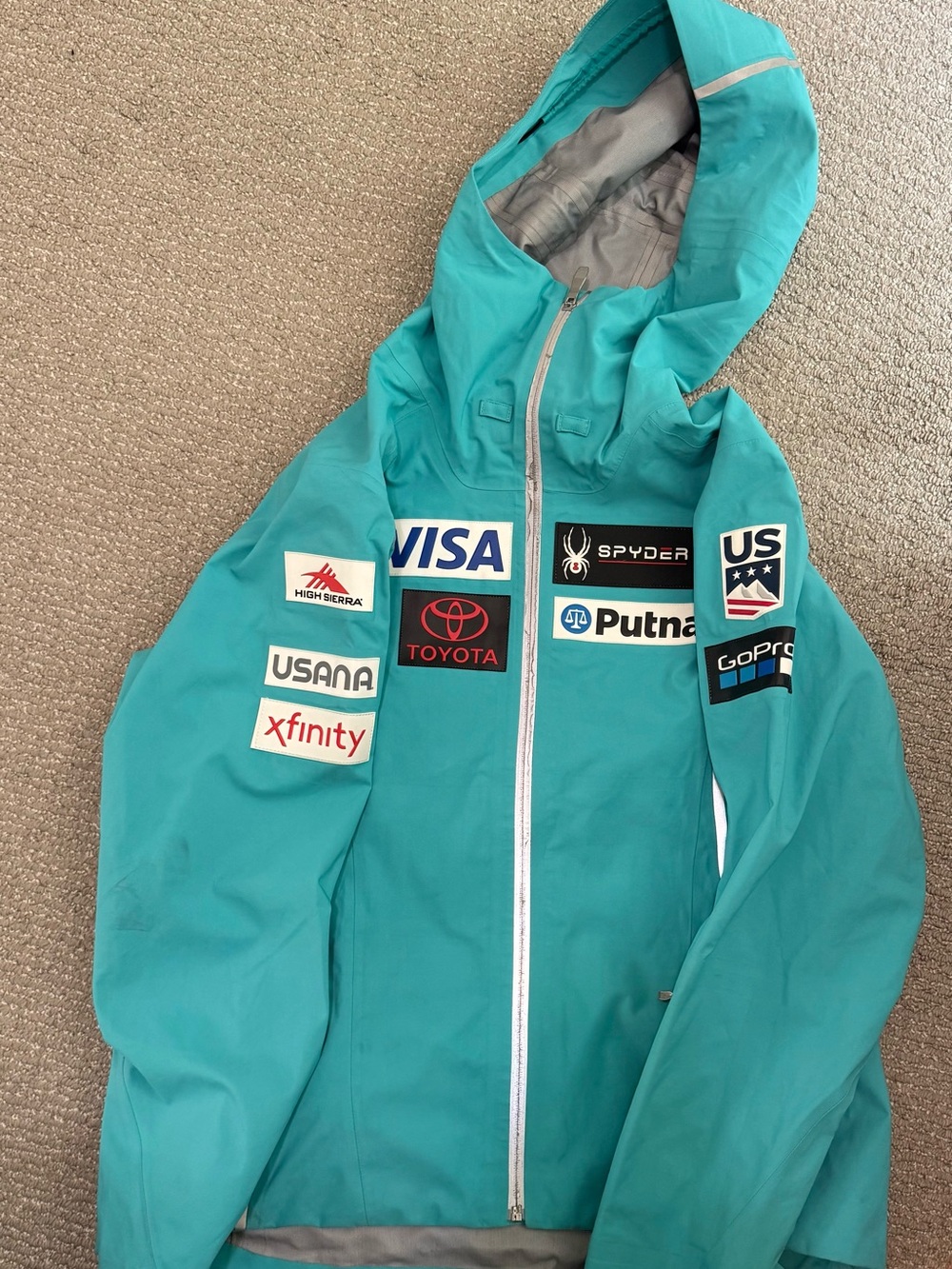 Spyder Teal Ski Jacket with Sponsor Patches